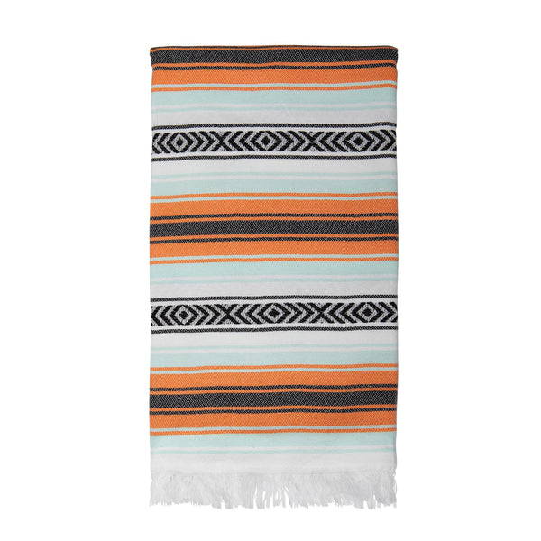 Image of Playa hammam towel, folded, on a white background. Hammam towel is orange, aqua and black stripes on a white background, with white fringing at each end. From Sand and Salt.
