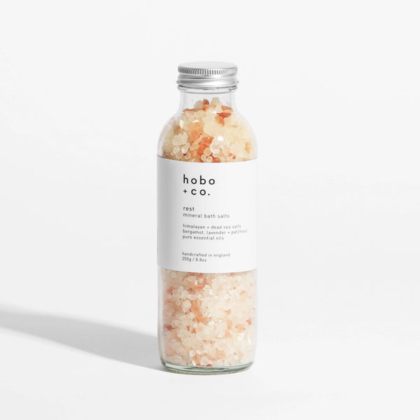 Bottle of hobo + co. bath salts on a white background