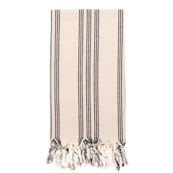Off white hammam towel with fine black stripes and hand knotted tassels at each end.