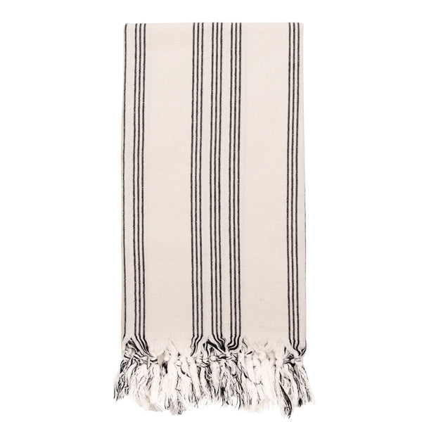 Cream cotton hammam towel with fine black stripes and knotted tassels on a white background.