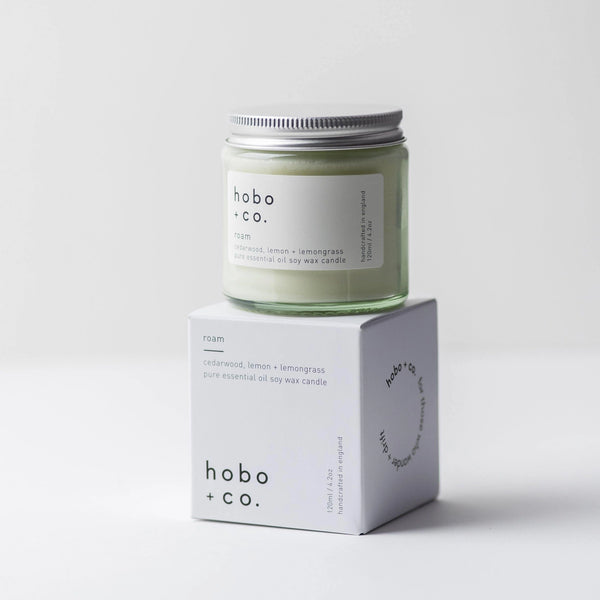 Hobo + Co candle and its packaging on a white background