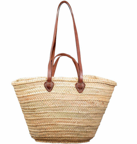 Beach basket with chestnut brown leather long and short handles.