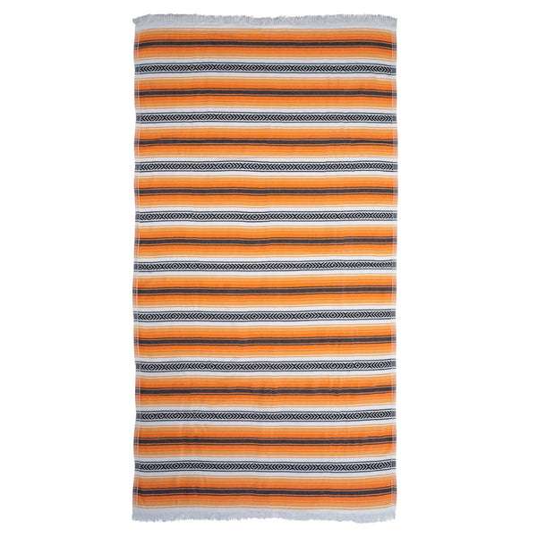 image of flat Playa hammam towel with orange and black stripes on a white background. Sold by Sand and Salt.