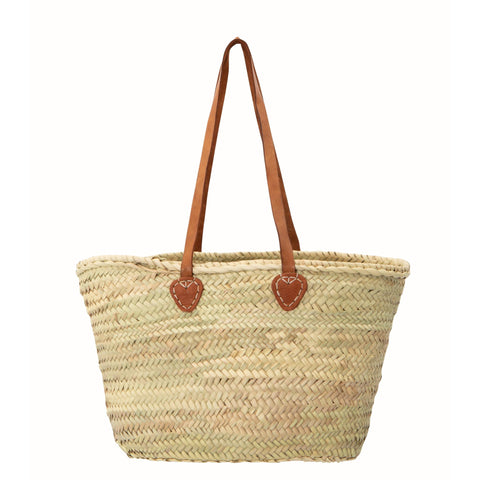 Single handle straw beach basket with long leather handles.