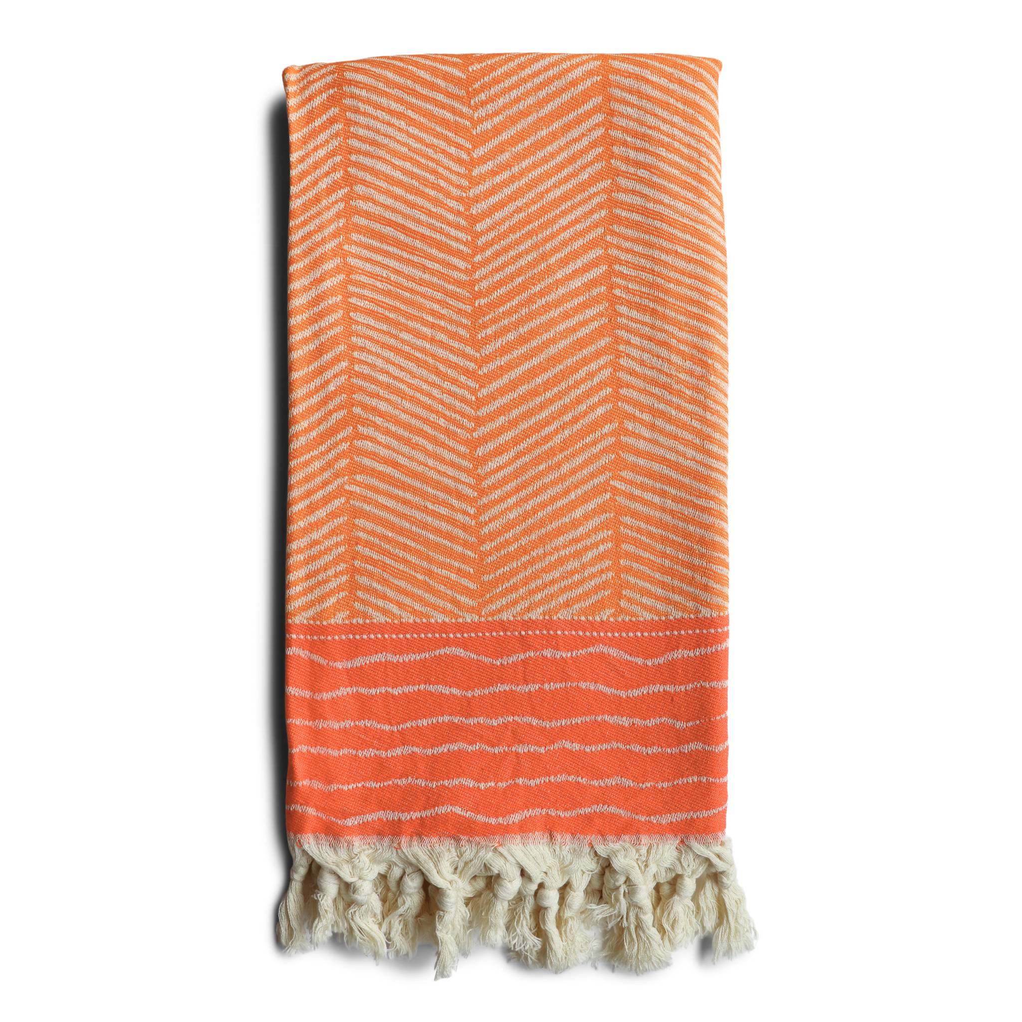 image of Skiathos hammam towel with a vibrant orange design on an off-white background. Fringing at both ends. Sold by Sand and Salt.