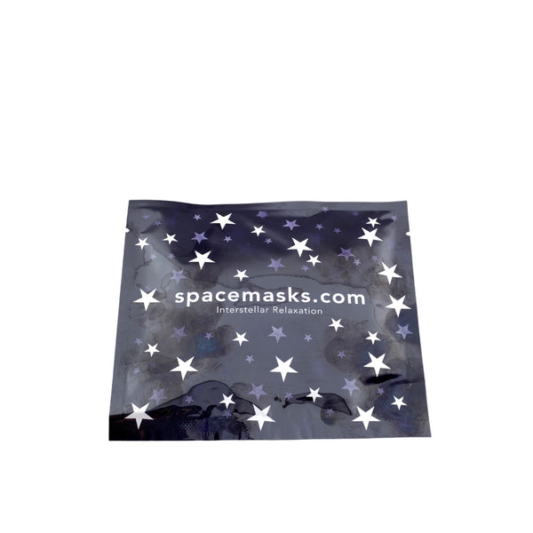 A navy blue Spacemask envelope with a star pattern and the text 'SpaceMasks.com - Intergalactic Relaxation' on it.