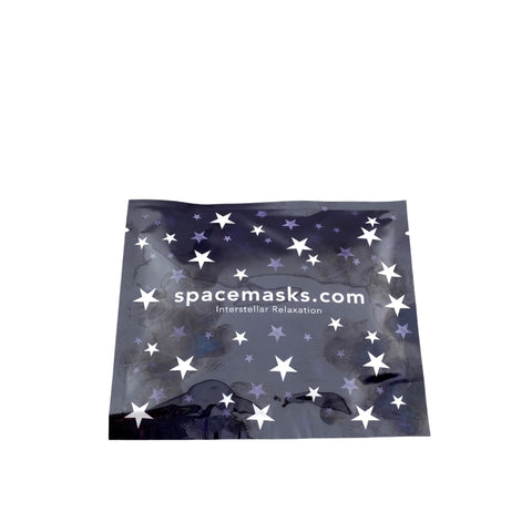 A navy blue Spacemask envelope with a star pattern and the text 'SpaceMasks.com - Intergalactic Relaxation' on it.