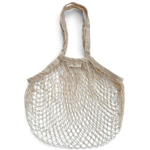 Image is of a natural cream coloured string shopping bag flat against a white background. Organic cotton string bag.