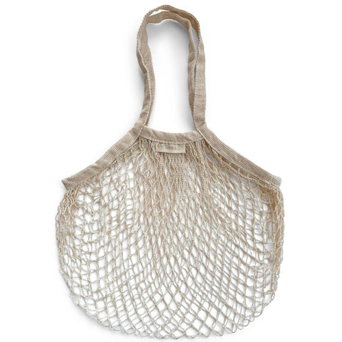 Image is of a natural cream coloured string shopping bag flat against a white background. Organic cotton string bag.